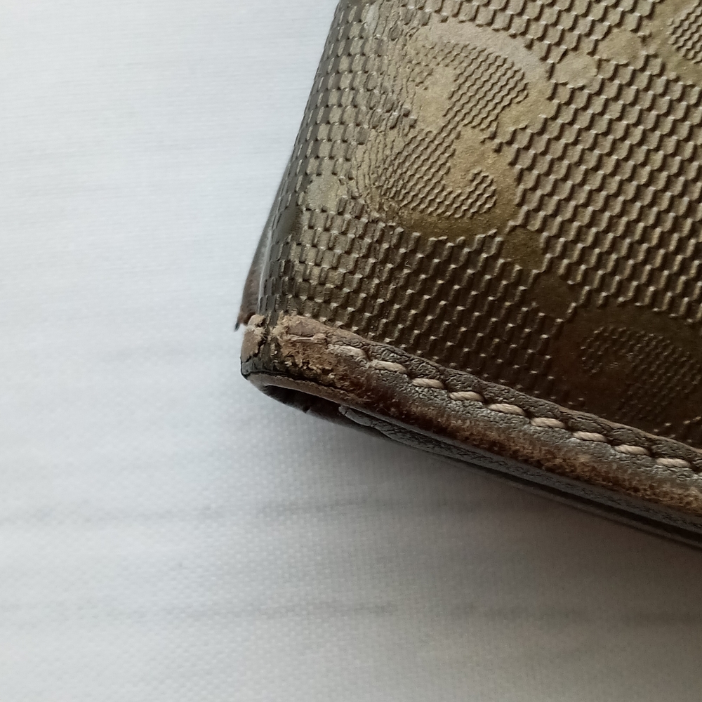 Authentic Gucci Metallic brown Signature wallet with GG charm - Picture 6 of 16